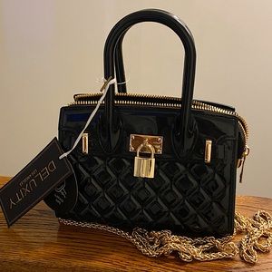 Deluxity quilted patent leather mini in black